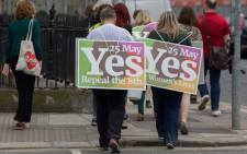 Activists from the 'Yes' campaign, urging people to vote 'yes' in the referendum to repeal the eighth amendment of the Irish constitution, canvas voters in Dublin on 24 May 2018. Picture: AFP