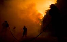 Firefighters battles the blaze. Picture: Thomas Holder/EWN