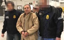 FILE: A handout picture released by the Mexican Interior Ministry on 19 January 2017 shows Joaquin Guzman Loera aka "El Chapo" Guzman (C) escorted in Ciudad, Juarez by the Mexican police as he is extradited to the United States. Picture: AFP