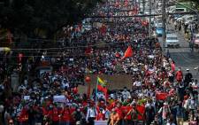 Protesters march during a demonstration against the military coup in Yangon on 7 February 2021. Picture: AFP