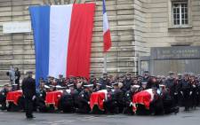 In this file photo taken on October 8, 2019 Police officers hold the coffins of their fallen colleagues during a ceremony at The Prefecture de Police de Paris (Paris Police Headquarters) in Paris, held to pay respects to the victims of an attack at the prefecture on October 4, 2019. Picture: AFP.
