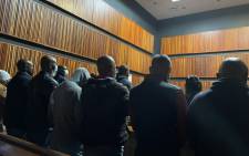 15 people arrested in connection with SAPS personal protective equipment (PPE) corruption worth R1.9 million appear in the Palm Magistrates Court. Picture: Masechaba Sefularo/Eyewitness News