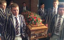 School learners carrying Pierre Korkie's coffin ahead of his memorial in Bloemfontein on 12 December 2014. Picture: Vumani Mkhize/EWN.