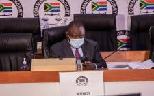 President Cyril Ramaphosa checks his phone ahead of the start of proceedings on his second day of testimony at the state capture inquiry on 29 April 2021 in Braamfontein, Johannesburg. Picture: Abigail Javier/Eyewitness News
