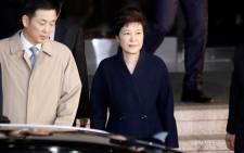 FILE: South Korea’s ousted leader Park Geun-hye leaves a prosecutor’s office in Seoul on 21 March 2017. Picture: AFP.
