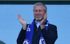 In this file photo taken on May 21, 2017 (FILES) In this file photo taken on 21 May 2017 Chelsea's Russian owner Roman Abramovich applauds, as players celebrate their league title win at the end of the Premier League football match between Chelsea and Sunderland at Stamford Bridge in London. Picture: Ben Stansall / AFP.