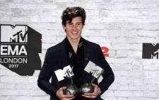 Canadian singer-songwriter Shawn Mendes poses with two of his three awards during the 2017 MTV Europe Music Awards (EMA) at Wembley Arena in London on 12 November 2017. Picture: AFP