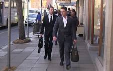 Oscar Pistorius is accompanied by his brother Carl as they head to the High Court chambers in Pretoria following day 38 of the athlete's murder trial. Picture: Reinart Toerien/EWN.