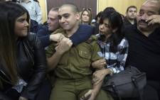 Israeli soldier Elor Azaria (centre), who shot dead a wounded Palestinian assailant, sits with his parents and girlfriend Orel as he awaits the verdict in his case at the military court in Tel Aviv on 4 January 2017. Picture: AFP.
