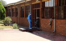 Forensic investigators comb the scene at the Khutlo-Tharo Secondary School in Sebokeng where a fire broke out in the early hours of 15 January 2020. Picture: Ahmed Kajee/EWN