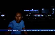A screengrab shows one of the men who mugged the SABC News crew who were preparing to go live on air outside Milpark Hospital on 10 March 2015.