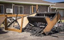 The remains of a piano sit atop a pile of charred furniture outside students' residences at the University of the Western Cape's Bellville campus after protests on Wednesday. Picture: Aletta Harrison/EWN