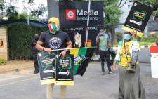 ANC members protest outside the eNCA head office in Hydepark following claims of racism against the media house's senior journalist Lindsay Dentlinger on 2 March 2021. Picture: @MYANC/Twitter