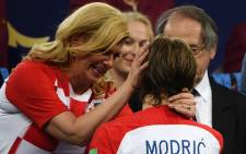 Croatian president Kolinda Grabar-Kitarović consoles Luca Modric following the team's 2018 Fifa World Cup final defeat to France on 15 July 2018. Picture: AFP
