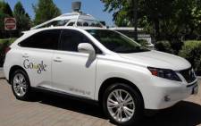 A Google self-driving car is seen in Mountain View, California, on 13 May, 2014. A white Lexus cruised along a road near the Google campus, braking for pedestrians and scooting over in its lane to give bicyclists ample space. Picture: AFP.