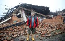 Tomislav Suknaic poses in front of his destroyed house in the village of Majske Poljane, where 5 people died, some 50km from Zagreb on 30 December 2020, a day after the region was hit by a 6.4-magnitude quake. Picture: AFP