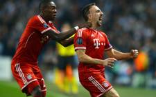 Bayern Munich's French midfielder Franck Ribery celebrates scoring the opening goal with Austrian defender David Alaba during the UEFA Champions League group D match against Manchester City at The City of Manchester stadium on October 2, 2013. Picture: AFP