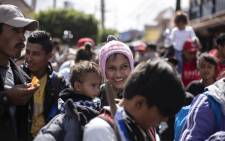 Central American migrants traveling in the "Migrant Via Crucis" caravan are pictured as they head to El Chaparral border crossing in Tijuana, Baja California state, Mexico, on April 29, 2018. At least 150 Central American migrants reached the border between Mexico and the United States on Sunday, determined to seek asylum from the US. Picture: AFP.