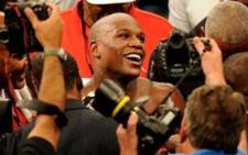 FILE: Floyd Mayweather Jr. reacts after defeating Shane Mosley by unanimous decision after the welterweight fight at the MGM Grand Garden Arena. Picture: AFP