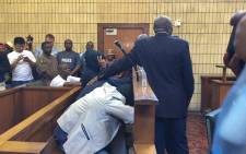 Titus Mabela, Jason Segole and Puleng Sebetwa sit in court during their bail application for allegedly killing Khulekani Mpanza. Picture: Masego Ragahla/EWN.