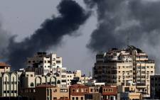 Smoke billows from Israeli air strikes in the Gaza Strip, controlled by the Palestinian Islamist movement Hamas, on 11 May 2021. Israel and Hamas exchanged heavy fire, in a dramatic escalation between the bitter foes sparked by unrest at Jerusalem's flashpoint Al-Aqsa Mosque compound. Picture: Mahmud Hams/AFP