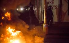 Police used live ammunition to scare off the protesters during a flare-up of xenophobic violence in central Johannesburg CBD on 17 April 2015. Picture: Thomas Holder/EWN
