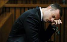 Oscar Pistorius wipes his face during his murder trial at the high court in Pretoria on 7 April 2014. Picture: Pool.