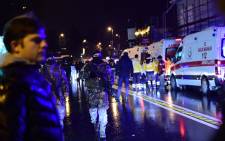 Turkish special force police officers and ambulances are seen at the site of an armed attack 1 January, 2017 in Istanbul. Picture: AFP.