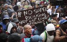 Residents from Imizamo Yethu protest outside the Cape Town Civic Centre. Residents protested against the ongoing super-blocking process in the informal settlement. Picture: Cindy Archillies/EWN.