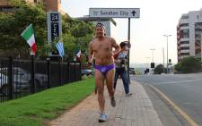 After losing a bet on 702's Afternoon Drive Show with Xolani Gwala, EWN's Derek Alberts  ran around the streets of Sandton in a speedo to raise funds for Grassroots Rugby in the Eastern Cape. Picture: Leeto Khoza/EWN.