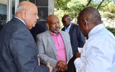 (L-R) Public Enterprises Minister Pravin Gordhan, Eskom board chairperson Jabu Mabuza, and President Cyril Ramaphosa (L) meet at the power utility’s headquarters at Megawatt Park, Johannesburg, on 11 December 2019 ahead of a meeting on the latest spate of power cuts in the country. Picture: @PresidencyZA/Twitter. 