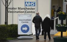 Members of the public arrive at the Etihad tennis centre as it opens as a mass vaccination centre against the coronavirus in Manchester, northwest England, on 11 January 2021. Picture: Oli Scarrf/AFP