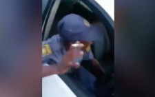 A screengrab taken from footage of a drunk police officer who allegedly nearly caused an accident.