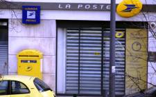 Picture taken of the post office where an armed man is holed up with two hostages, on 16 January, 2015 in Colombes, outside Paris. Picture: AFP.