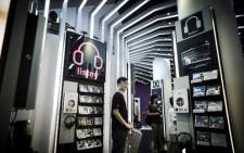 A shop employee holds an empty basket as in a shop selling music CDs in Hong Kong. Picture: AFP.