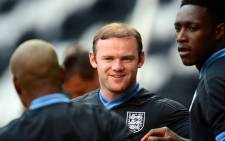 England's forward Wayne Rooney (C) and English forward Dany Welbeck (R) take part in a training session at the Dombass Arena stadium in Donetsk on 10 June, 2012. Picture: AFP