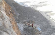 This handout photograph provided by the Indo Tibetan Border Police and taken on 7 February 2021 shows Indo Tibetan Border Police personnel during a rescue operation to clear Tapovan tunnel from debri following floods after glacier broke off in Chamoli district. Picture: AFP