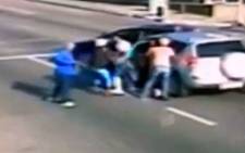 The hijacking of an Ethiopian family on 16 November 2013 in the Johannesburg CBD was captured on CCTV cameras and the footage has since gone viral. Picture: YouTube.