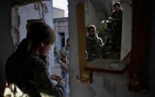 FILE:A fighter of the Syrian Kurdish People’s Protection Units (YPG) prepare to fight against Islamic State (IS) group on 7 November, 2014 in the Syrian besieged border town of Ain al-Arab (known as Kobane by the Kurds). Picture: AFP.