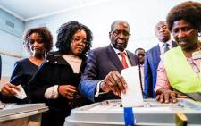 Former Zimbabwean president Robert Mugabe (C) his daughter Bona (C) and wife Grace cast their votes at a polling station at a primary school in the Highfield district of Harare during the country's general elections on July 30, 2018. Picture: AFP