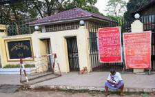  In this file photo taken on 12 April 2021 a man sits in front of Insein prison while waiting to visit inmates in Yangon. Myanmar will release more than 5,000 people jailed for protesting against a February coup which ousted the civilian government, the country's junta chief said 18 October 2021. Picture: AFP