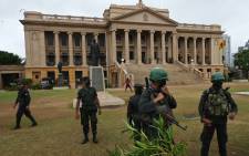 Security personnel stand guard outside the Sri Lankan Presidential Secretariat building in Colombo on 22 July 2022. Picture: Arun SANKAR/AFP
