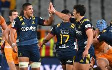 FILE: Highlanders' Liam Squire (L) and Thomas Umaga-Jensen celebrate their victory during a Super Rugby match on 11 May 2019. Picture: AFP