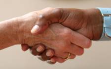 People shaking hands. Picture: Free Images.
