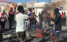 Khayelitsha residents singing during a service delivery protest on 11 April. Picture: Kaylynn Palm/EWN