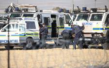 Police closely monitor protests in Marikana in the North West on 14 August 2012. Picture: EWN.