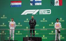 (From left) Second-placed Red Bull's Dutch driver Max Verstappen, winner Mercedes' Finnish driver Valtteri Bottas and third-placed Red Bull's Mexican driver Sergio Perez pose during the podium ceremony after the Formula One Grand Prix of Turkey at the Intercity Istanbul Park in Istanbul on 10 October 2021. Picture: UMIT BEKTAS/AFP