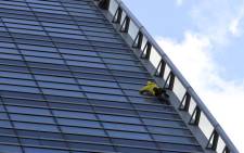 Alain Robert, the French urban climber dubbed Spiderman, climbs French Energy group Engie's building in the La Defense business district outside Paris on 25 March 2019. Picture: AFP