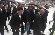 Orlando Pirates players follow behind the casket of Senzo Meyiwa. Picture: Marc Lewis