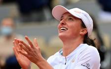 Poland's Iga Swiatek celebrates after winning against Sofia Kenin of the US during their women's singles final tennis match on Day 14 of The Roland Garros 2020 French Open tennis tournament in Paris on October 10, 2020. Picture: AFP